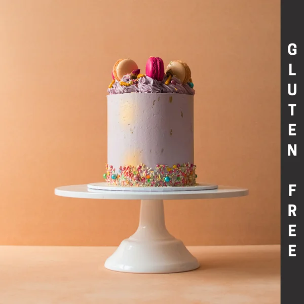Gluten Free purple cake with macaroons and sprinkles