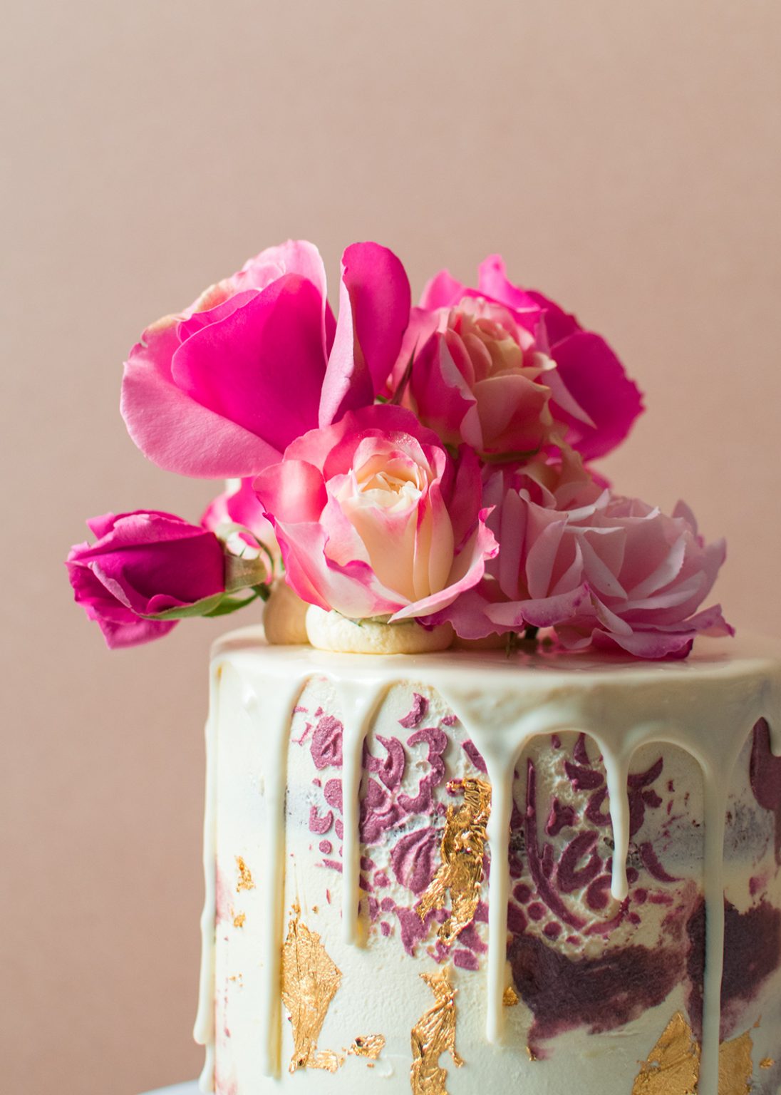 A close up image of a vintage cake with flowers on top