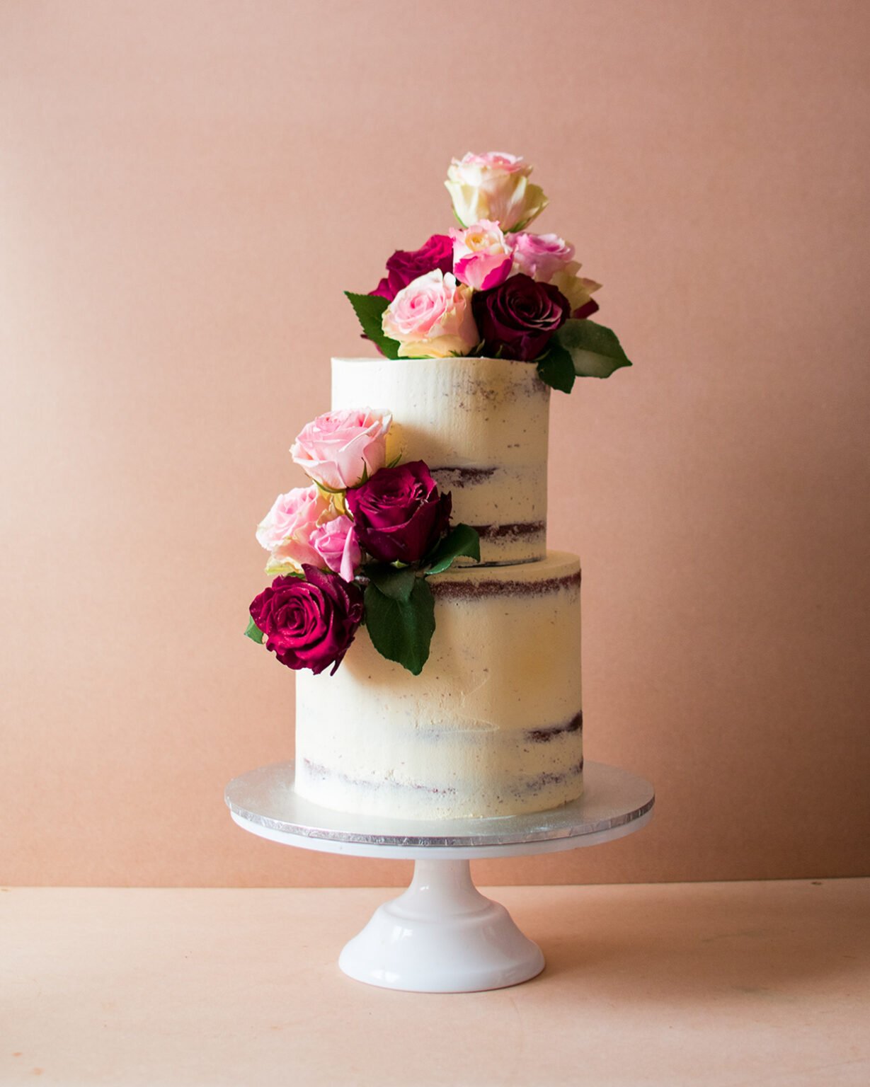 Two tier wedding cake with roses