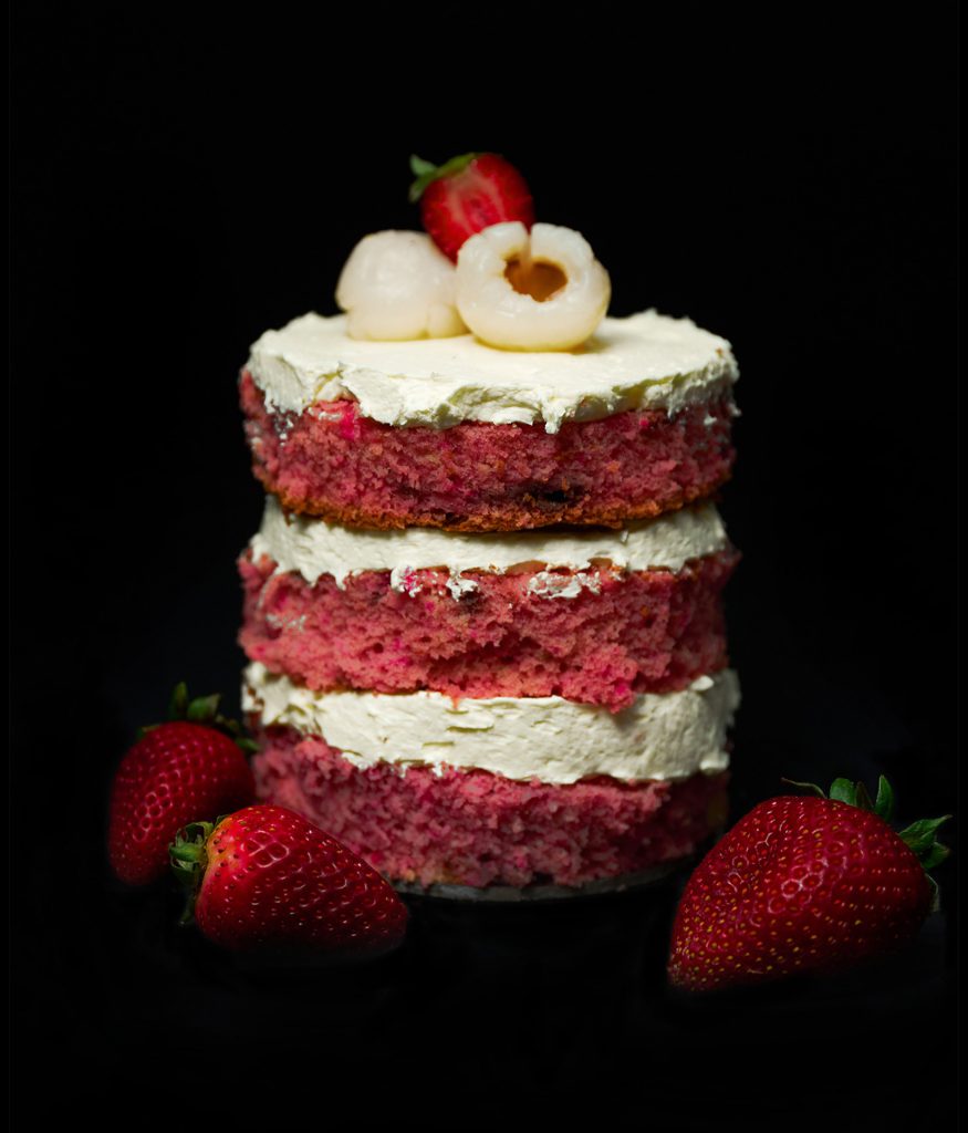 Strawberry sponge and lychee mini cake with lychee and strawberry on top