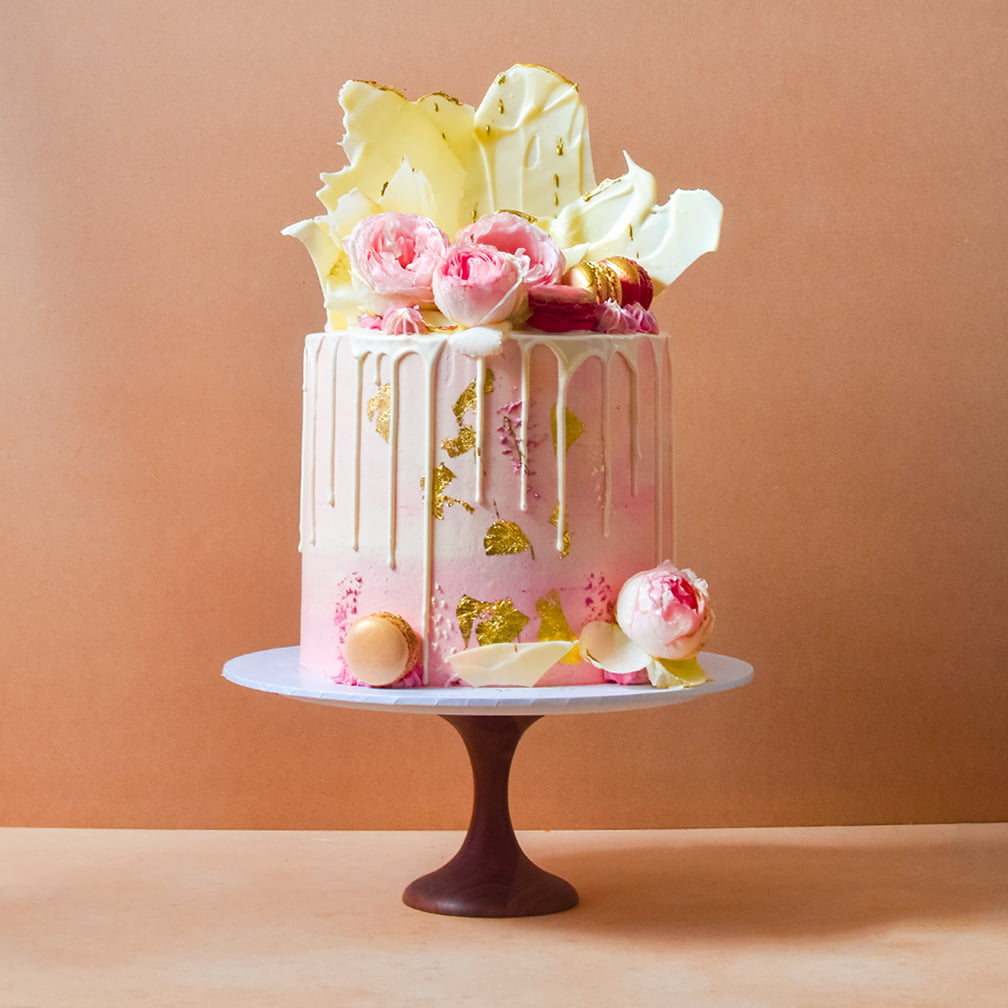 Pink cake with white chocolate drip and shards